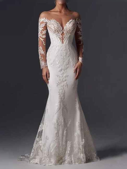 White A-line wedding dress with corset bodice, sheer lace sleeves, floral appliques, V-neck.