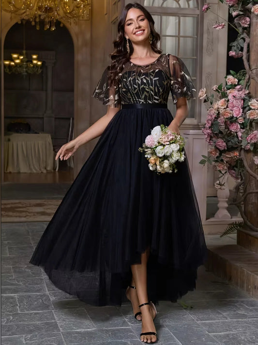Black A-line maxi prom dress with embroidered ruffled short sleeves and tiered tulle skirt.