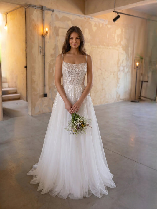 Ivory floral lace square-neck A-line tulle wedding dress with spaghetti straps, floor-length.