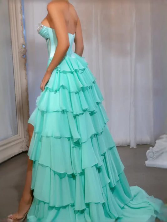 Strapless turquoise prom dress with tiered layered skirt and embellished bodice back