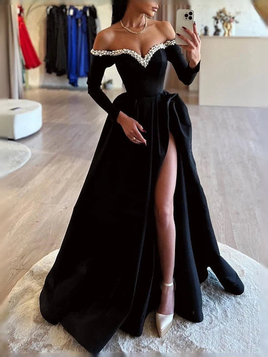 Black off-shoulder satin prom dress with beaded trim, flowing A-line skirt and front slit