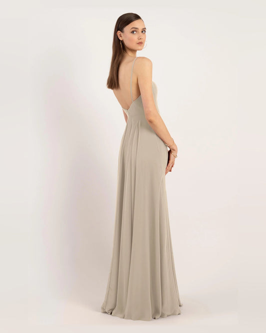 Light gray A-line maxi dress with spaghetti straps and pleated flowing skirt
