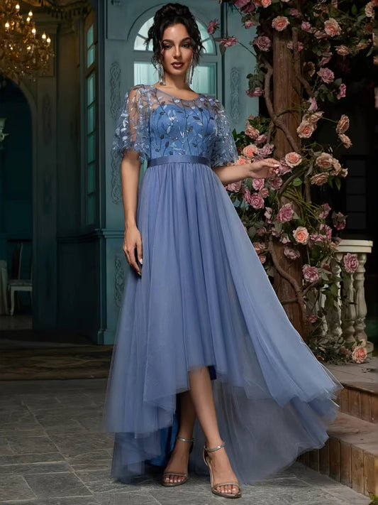 Slate blue A-line maxi prom dress with embroidered ruffled short sleeves and layered tulle skirt.