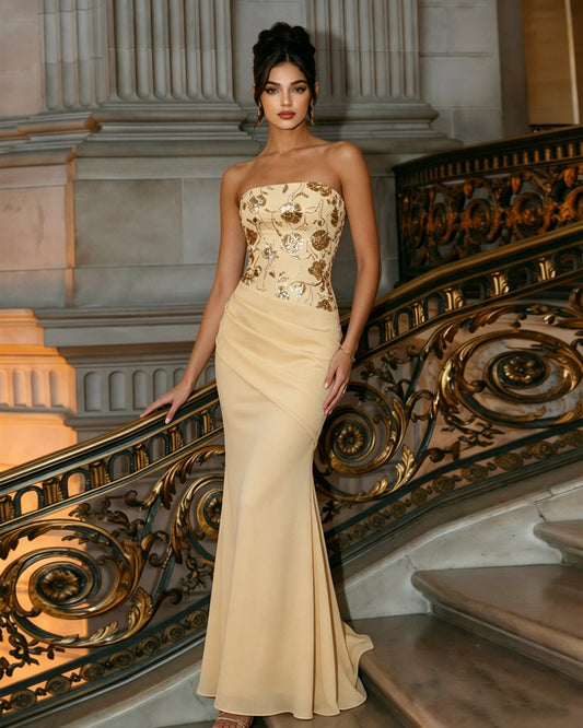 Ivory-yellow strapless column formal dress with ornate embroidered bust and draped hip