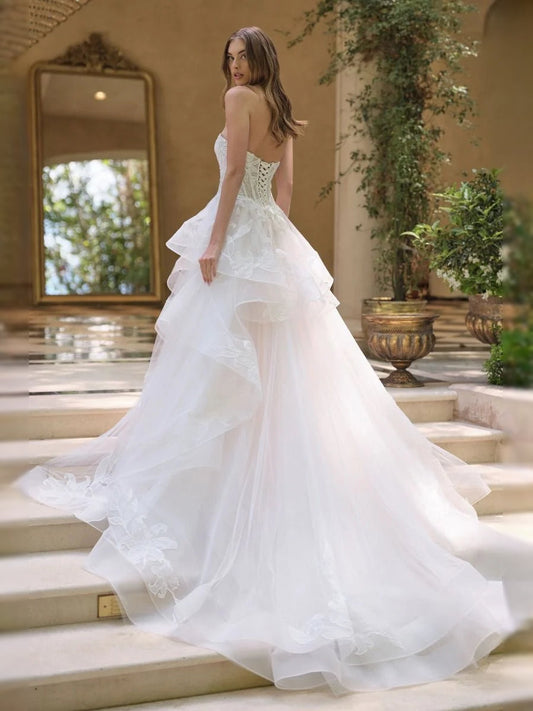 Ivory corset-style wedding dress with floral embroidery, ruffled V-neck A-line tulle skirt