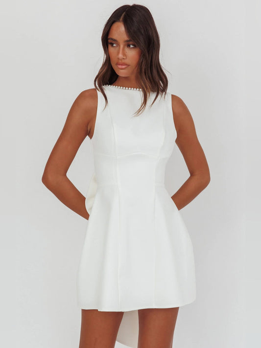 White sleeveless mini dress with pearl-trim high neckline and A-line skirt