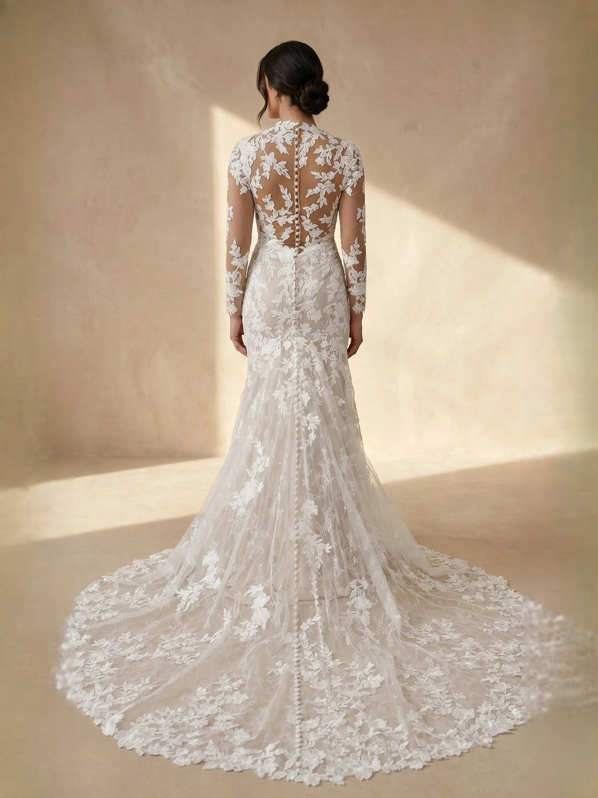 Ivory lace mermaid wedding dress with high neck illusion back and long sheer sleeves.