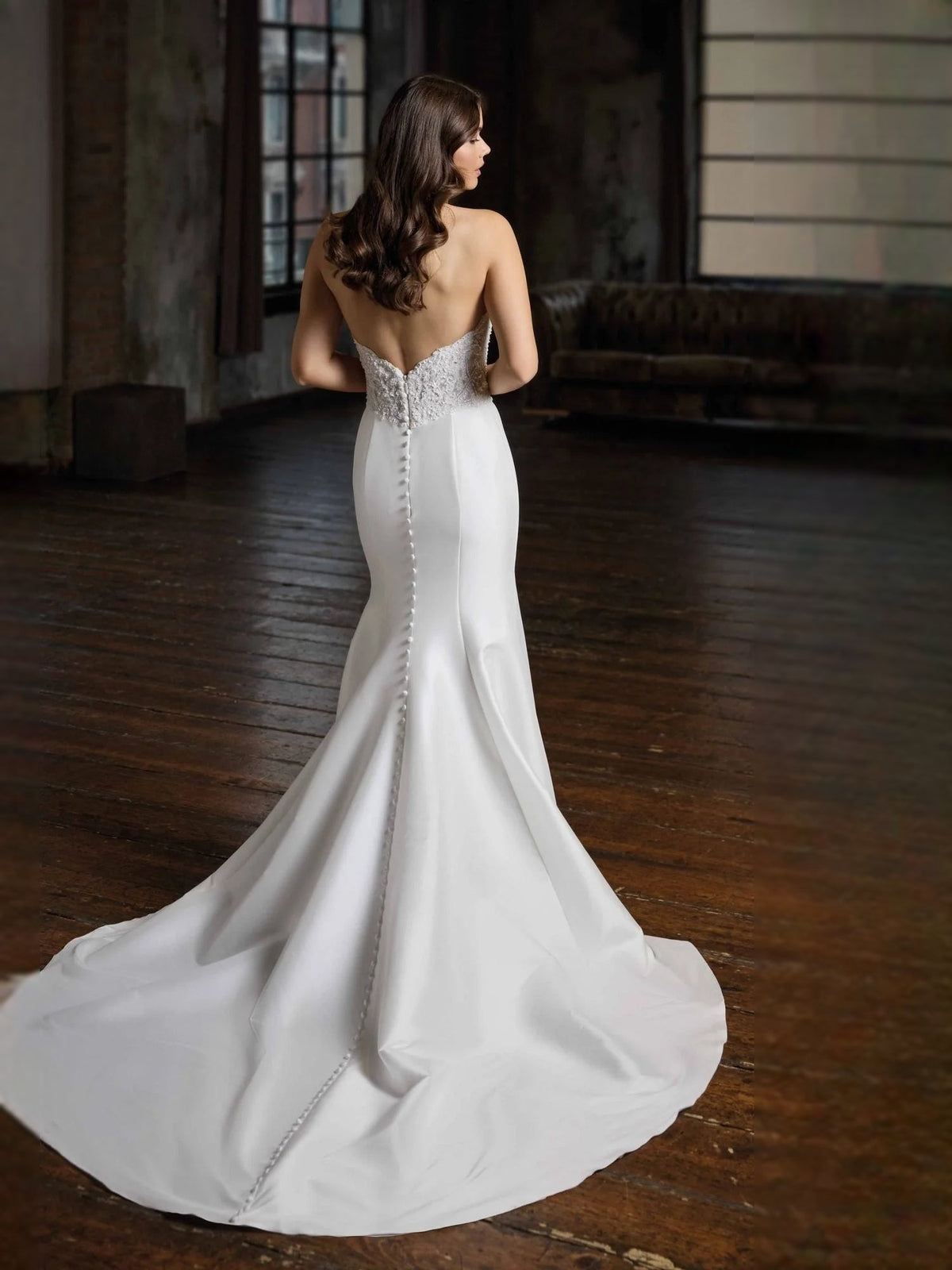 Ivory strapless mermaid wedding dress with beaded floral bodice and satin skirt