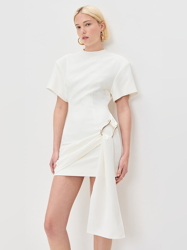 White mini dress with draped side panel and gold-tone tie detail