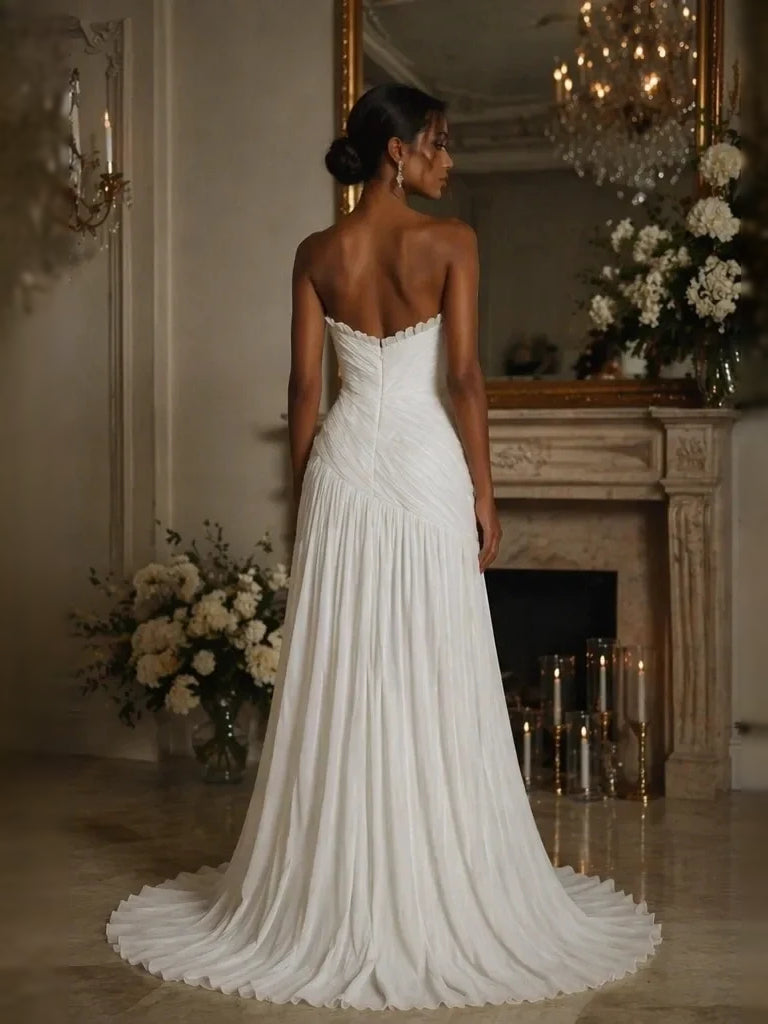 Ivory strapless ruched mermaid wedding dress, pleated flowing back view