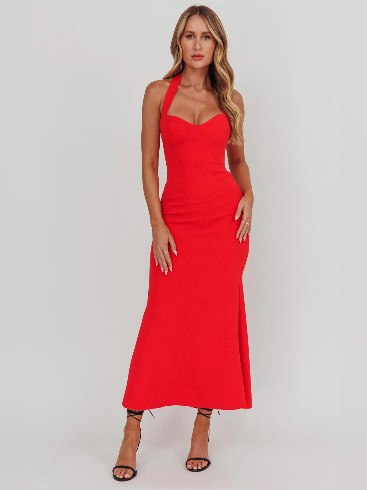 Red sheath maxi formal dress with halter neckline, full-length front view