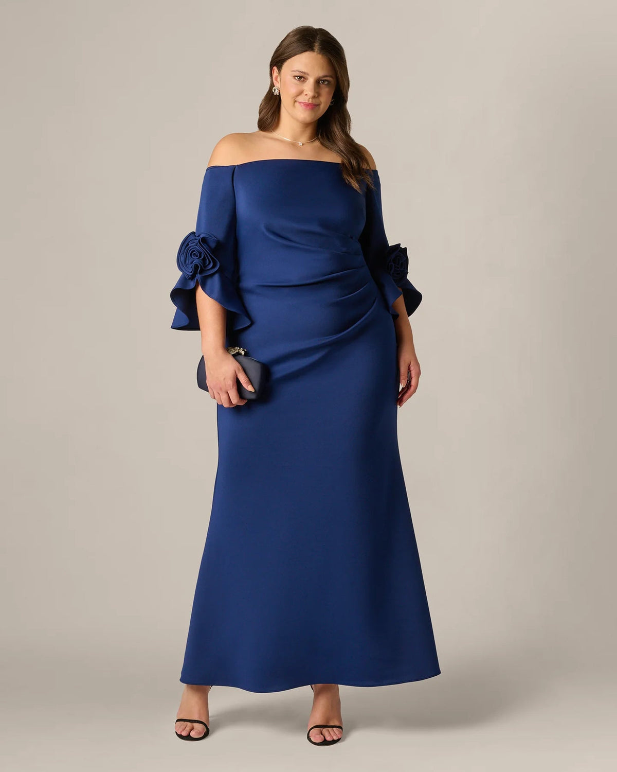 Navy off-shoulder A-line maxi dress with draped bodice and rosette sleeve details