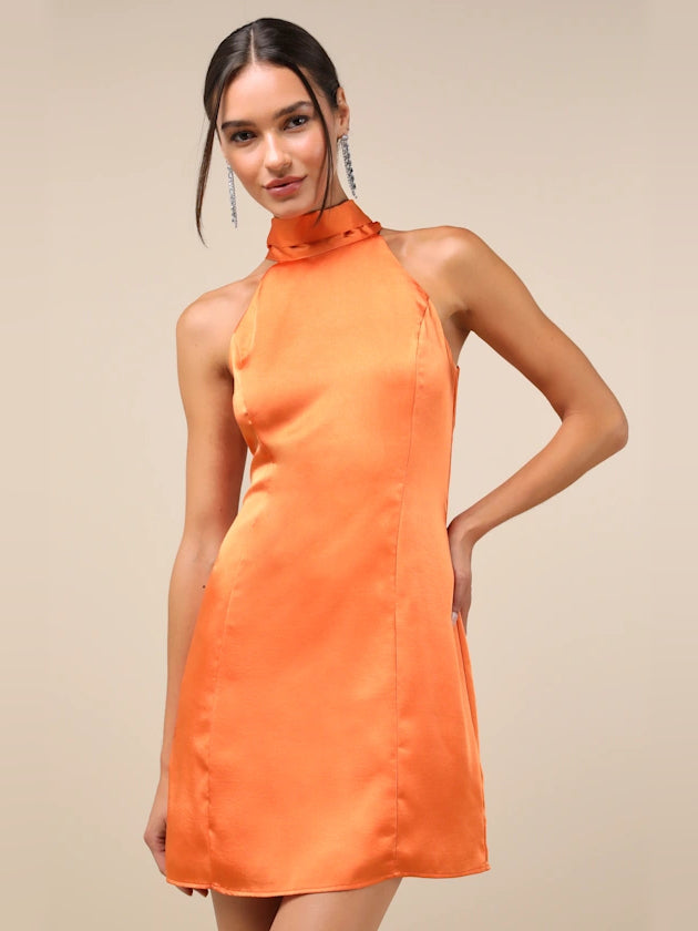 Orange satin halter neck mini dress with fitted bodice and smooth skirt