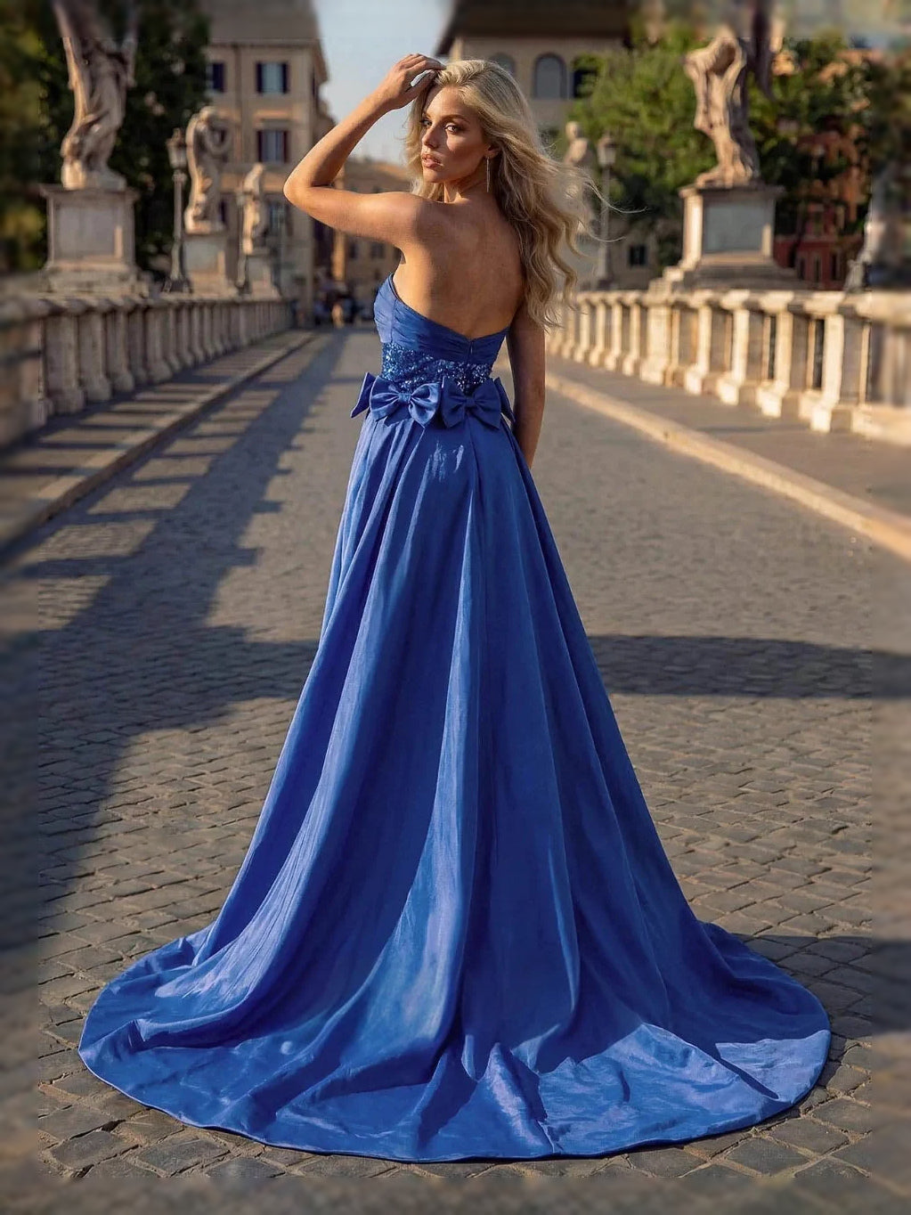 Royal blue sequin sweetheart ball gown with bow, floor-length skirt