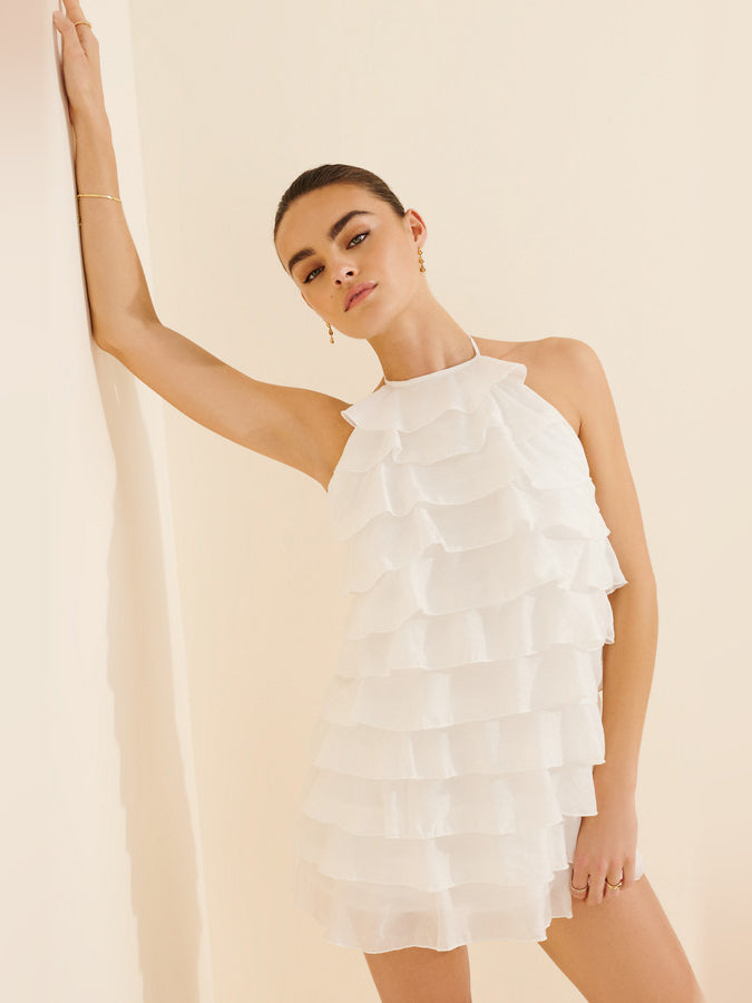 White tiered mini homecoming dress with ruffled halter neckline