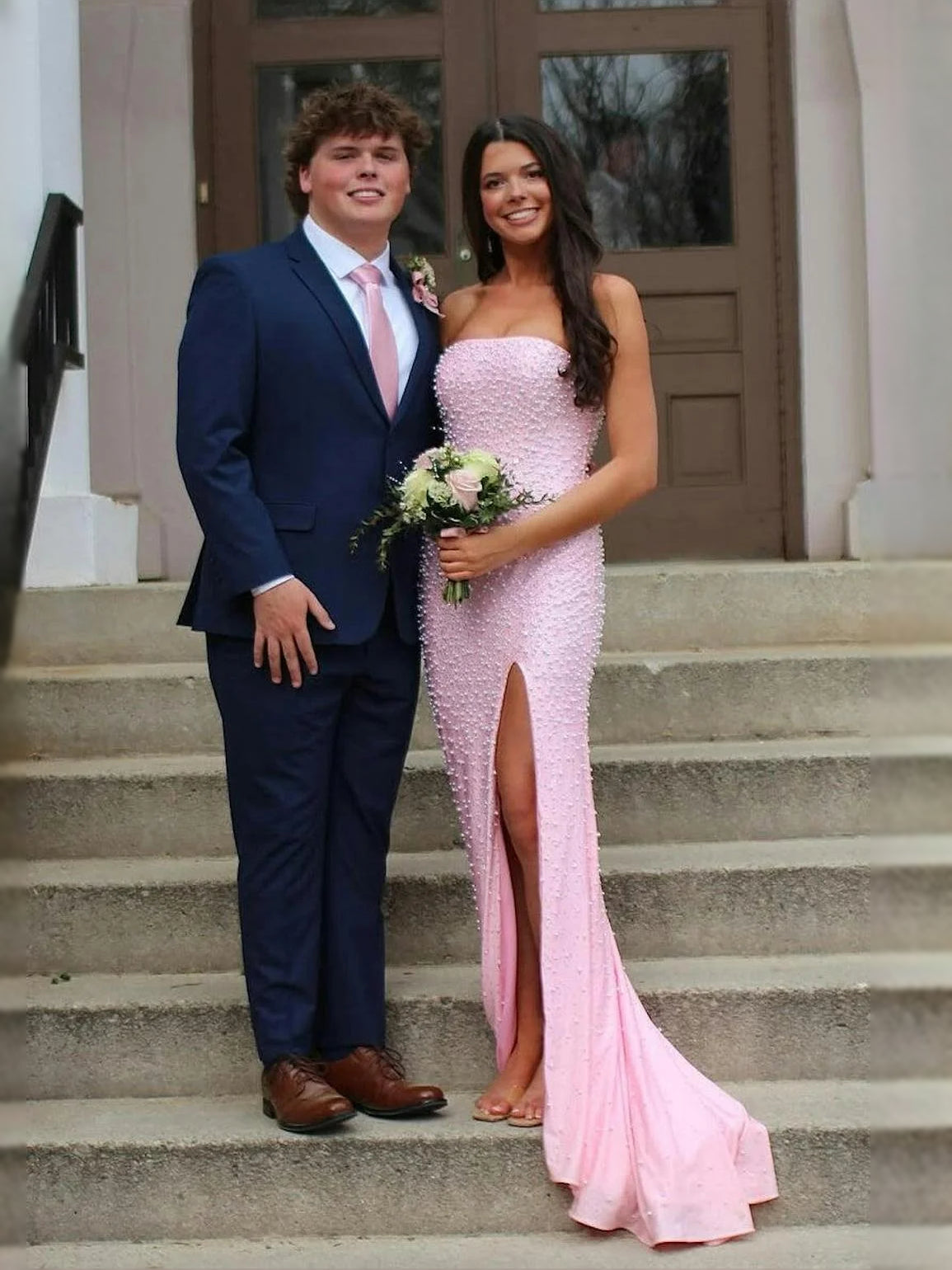 Pink strapless corset-style mermaid prom dress, beaded with thigh-high slit