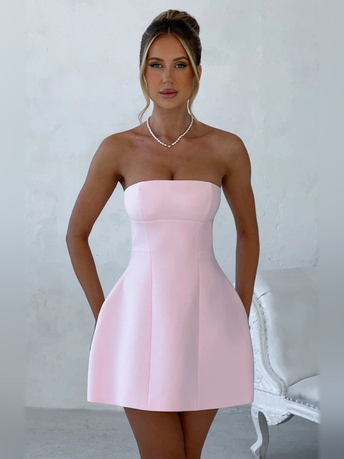 Blush strapless fit-and-flare mini dress with sweetheart neckline and seam detailing