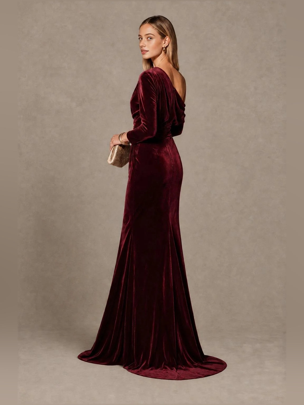 Burgundy velvet one-shoulder mermaid gown with draped bodice and long sleeve