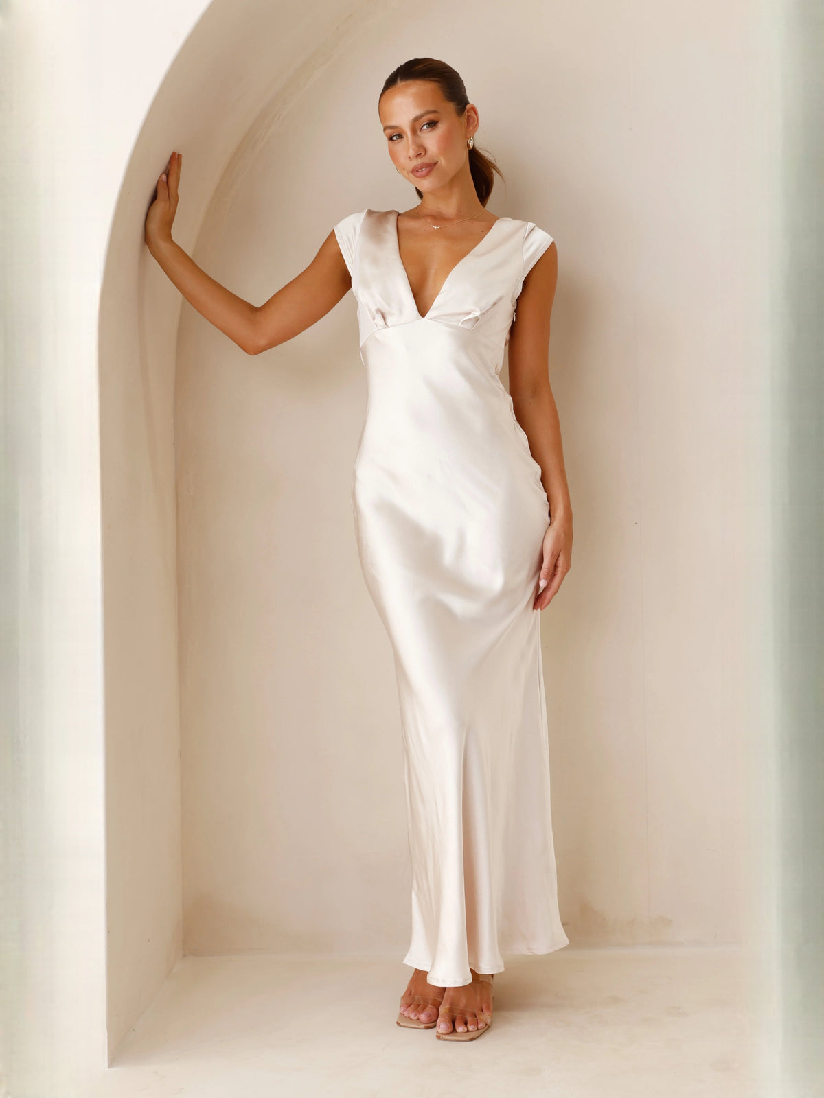 Champagne sheath maxi formal dress with V-neckline, full-length front view