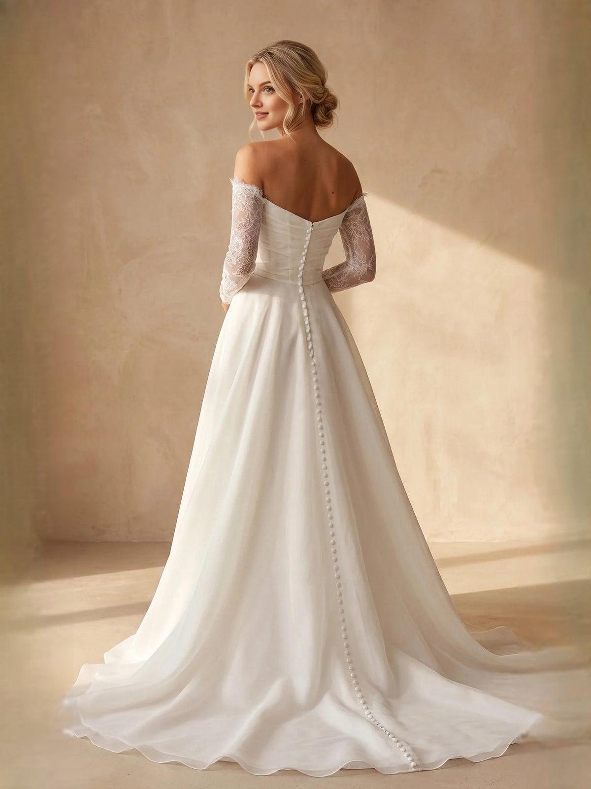 Ivory off-shoulder A-line wedding dress with lace sleeves and draped bodice train
