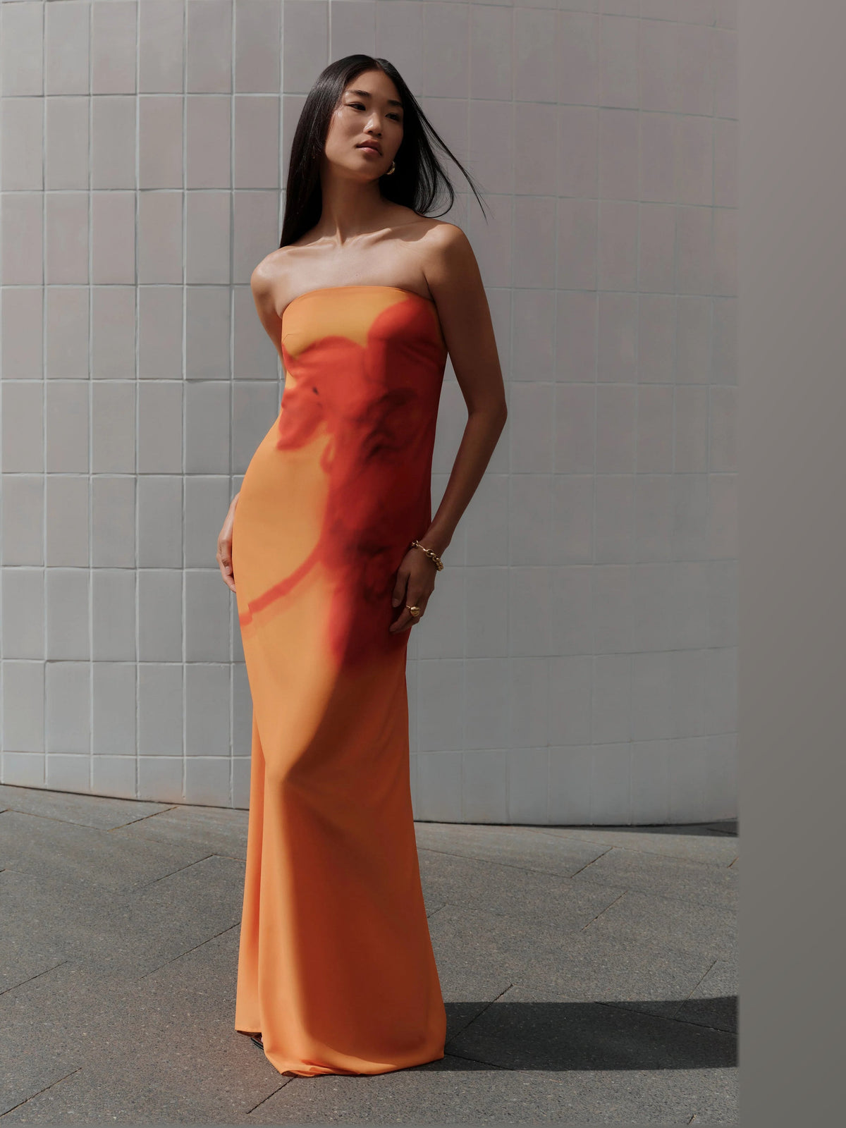 Orange formal dress with a-line silhouette and maxi length
