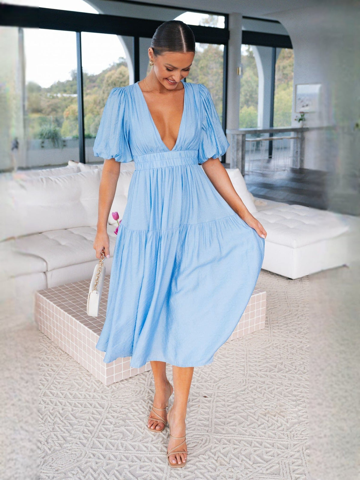 Blue midi formal dress with V-neck, tiered skirt, and short puff sleeves