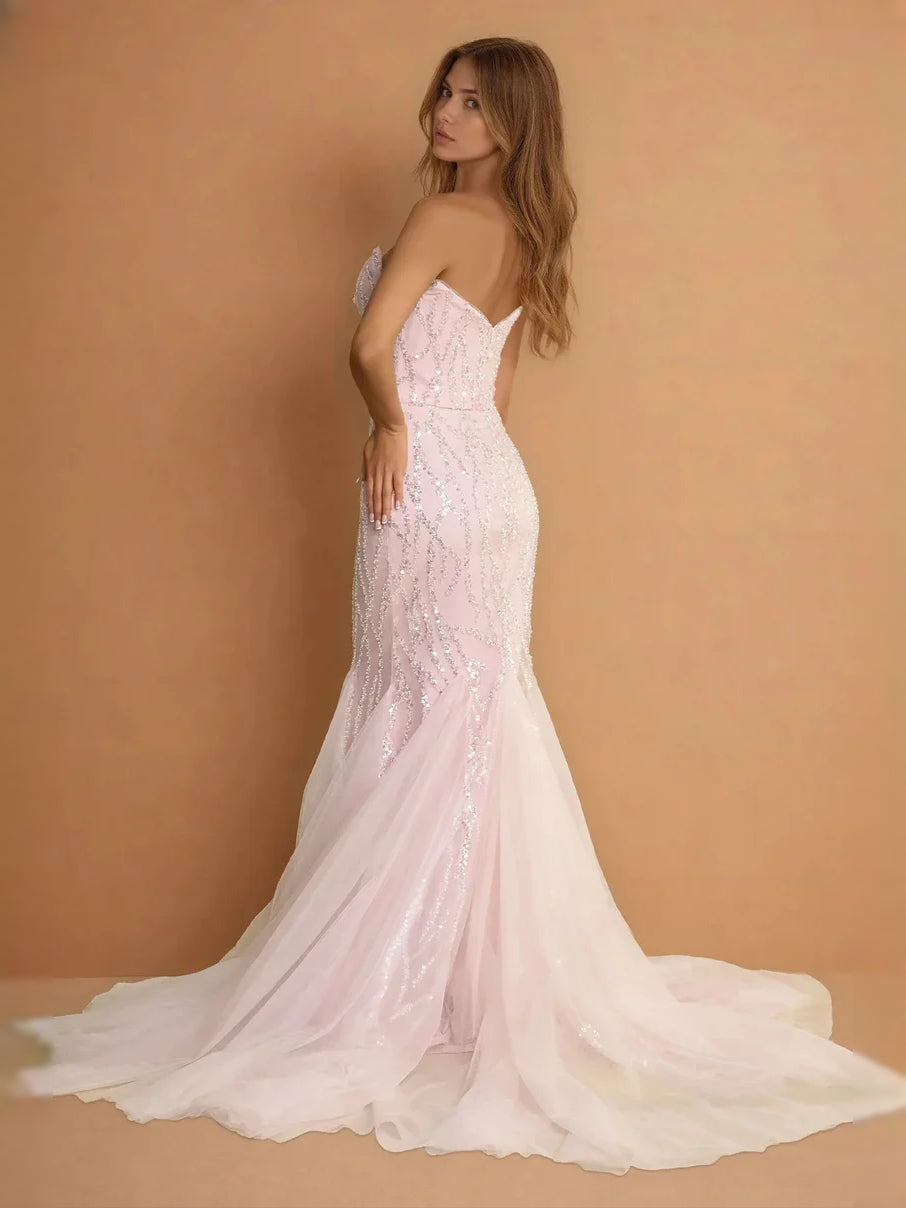 Blush pink strapless mermaid prom dress with beaded sequin bodice and flowing tulle skirt