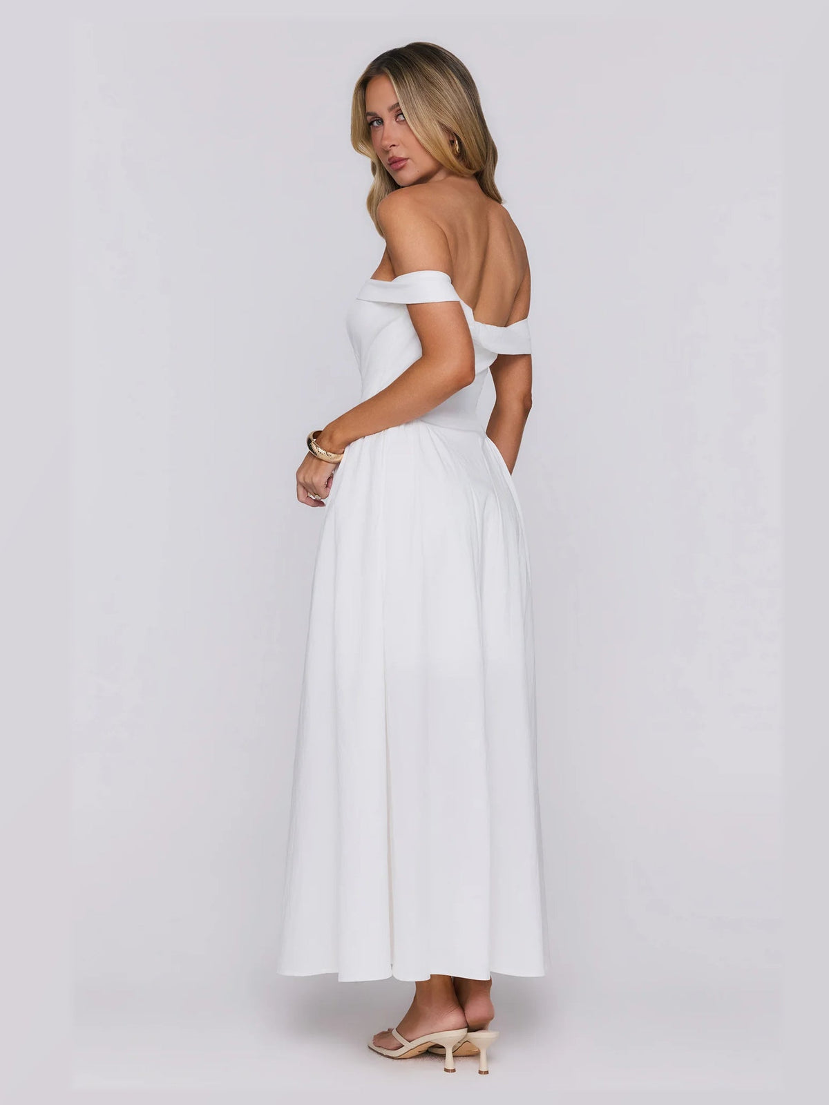 White formal dress with a-line silhouette and maxi length