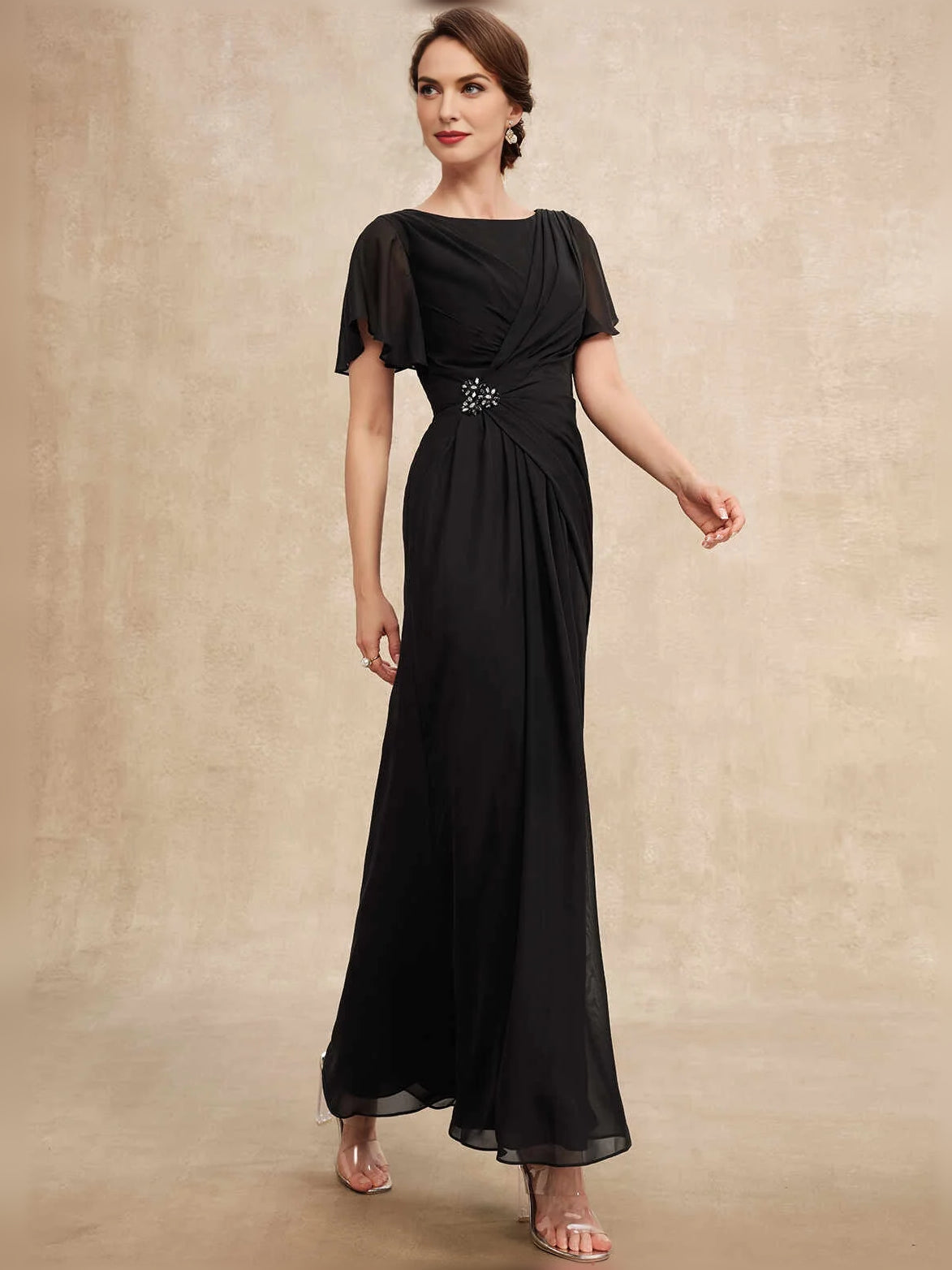 Black chiffon A-line maxi dress with bateau neckline, ruched drape and flutter sleeves