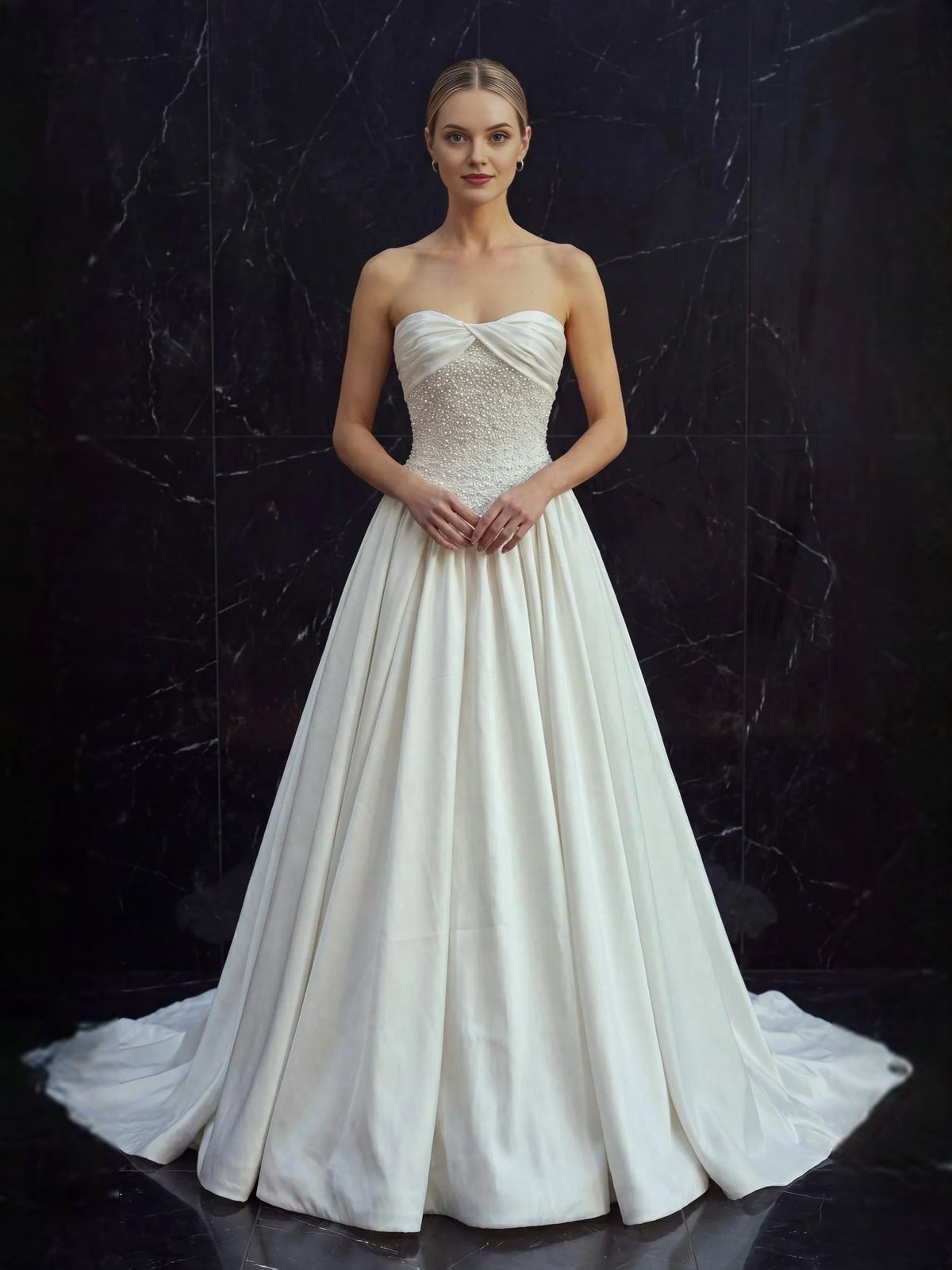 Ivory strapless A-line satin wedding dress with draped bodice and beaded waist