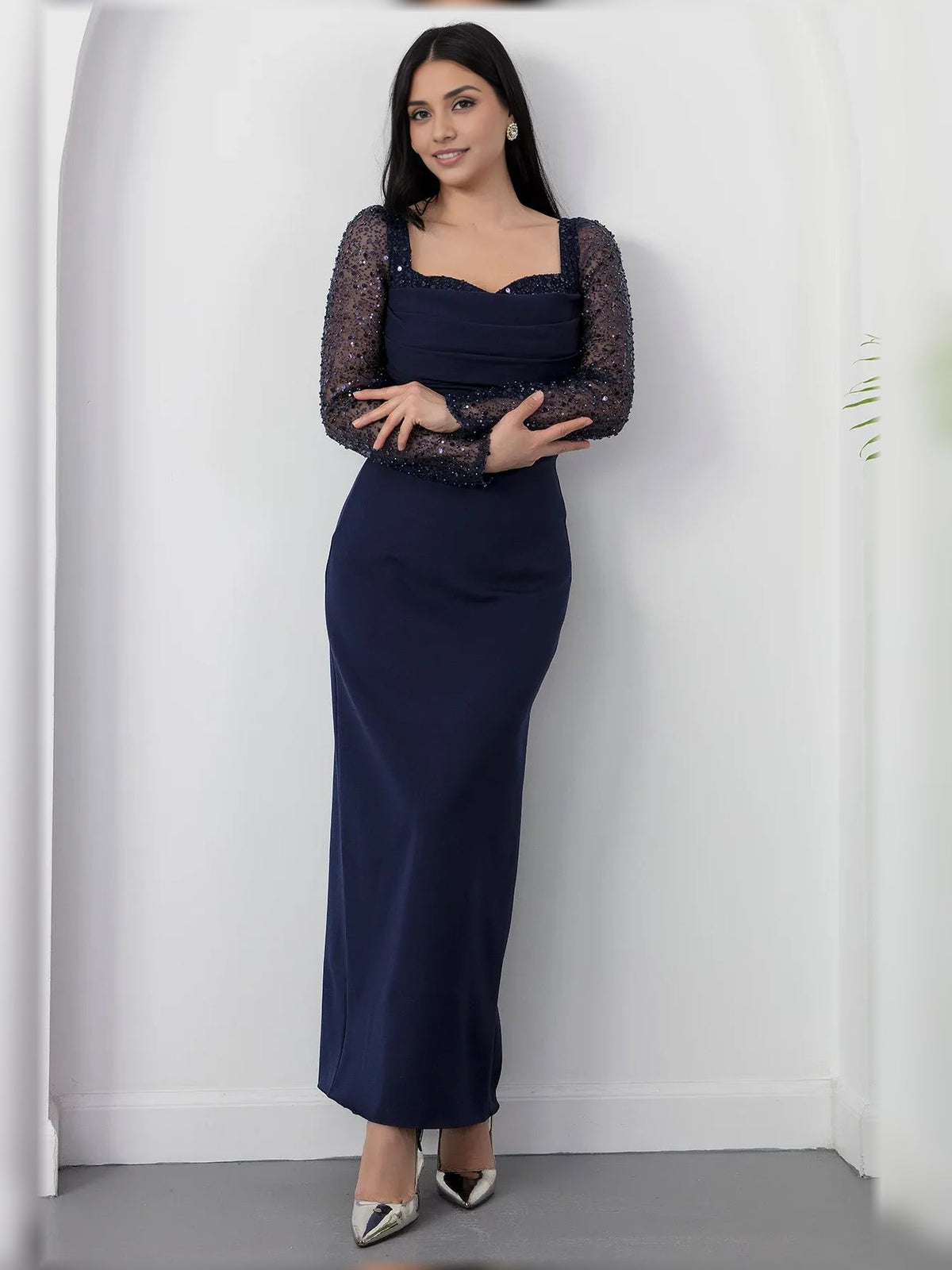 Navy blue square-neck formal dress with long sleeves and ruching, floor-length