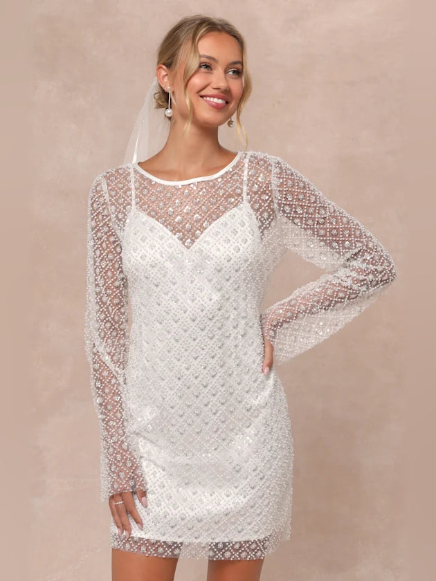 White sequin long-sleeve mini homecoming dress, mesh sleeves, round neckline.