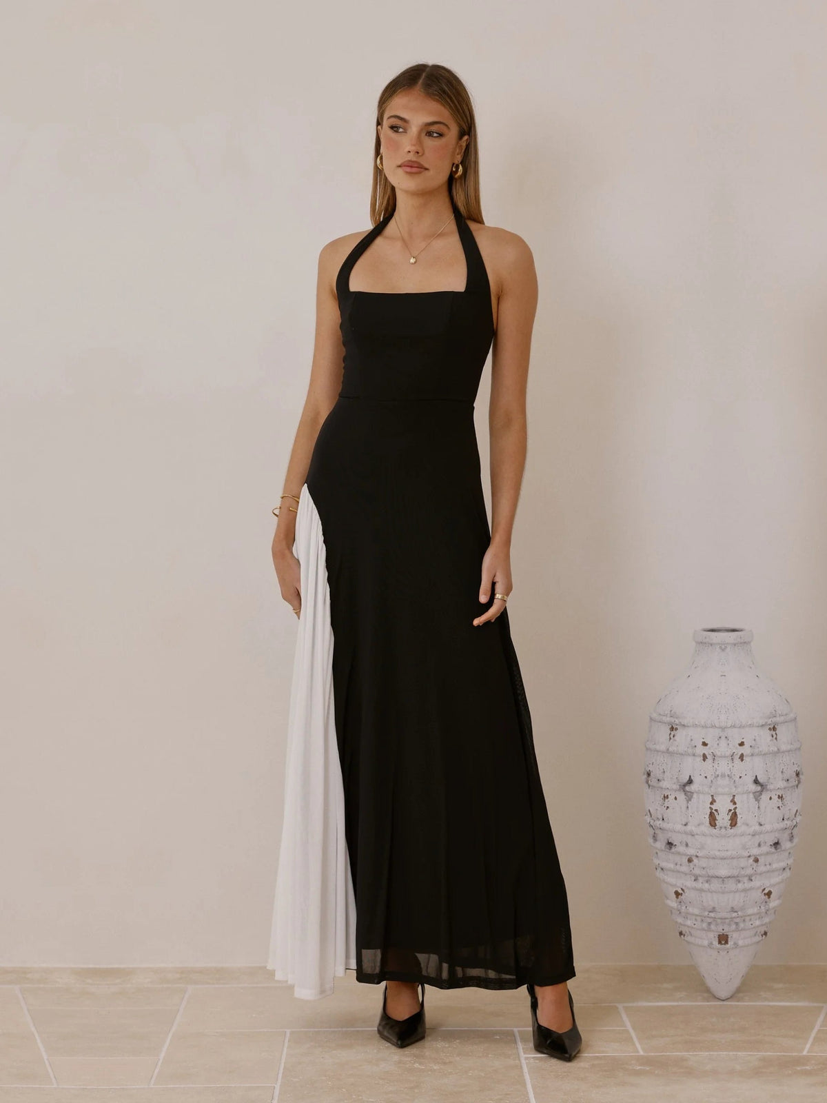 White sheath maxi formal dress with halter neckline, full-length front view