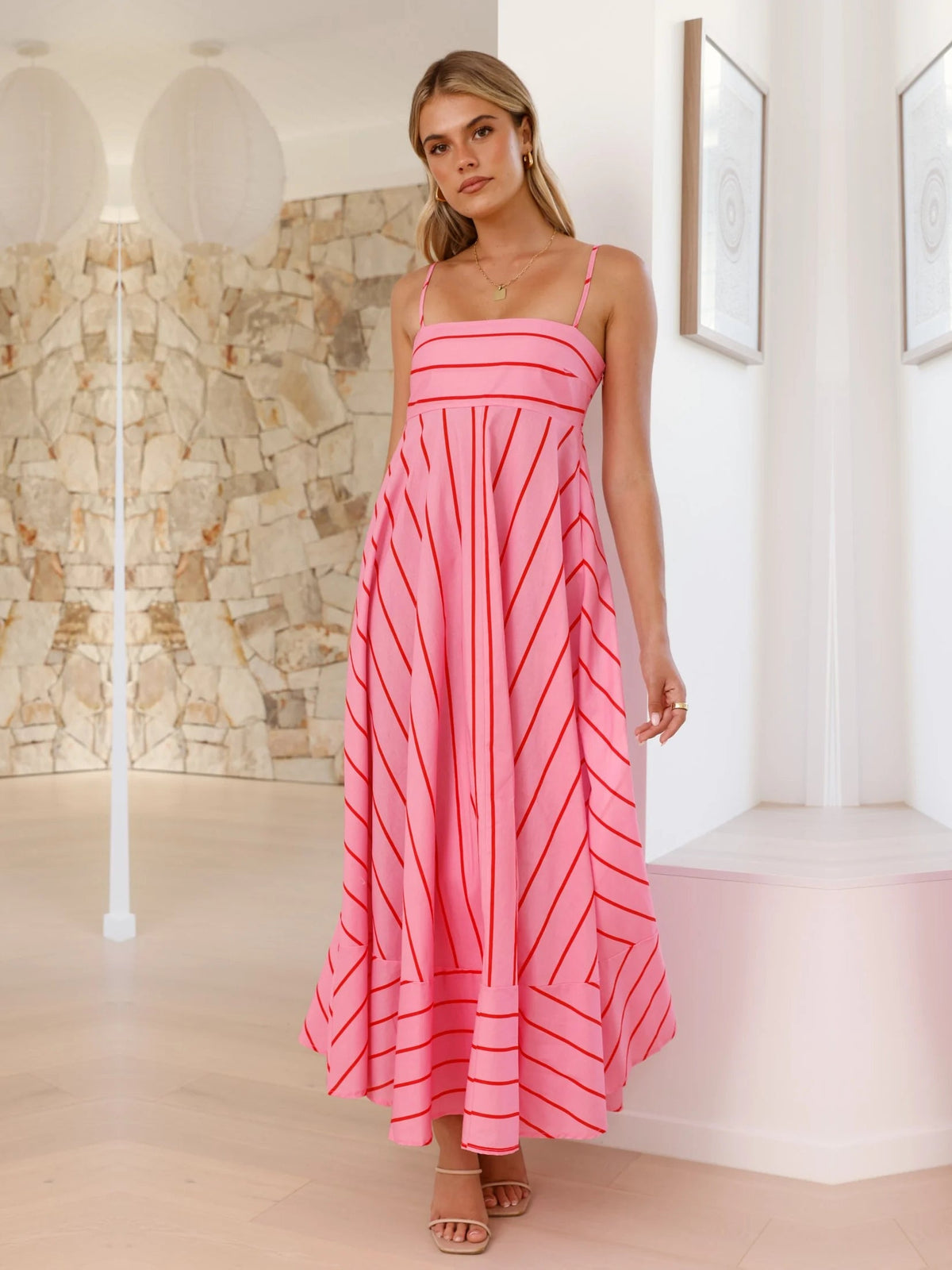 Pink a-line maxi formal dress with strapless neckline, full-length front view