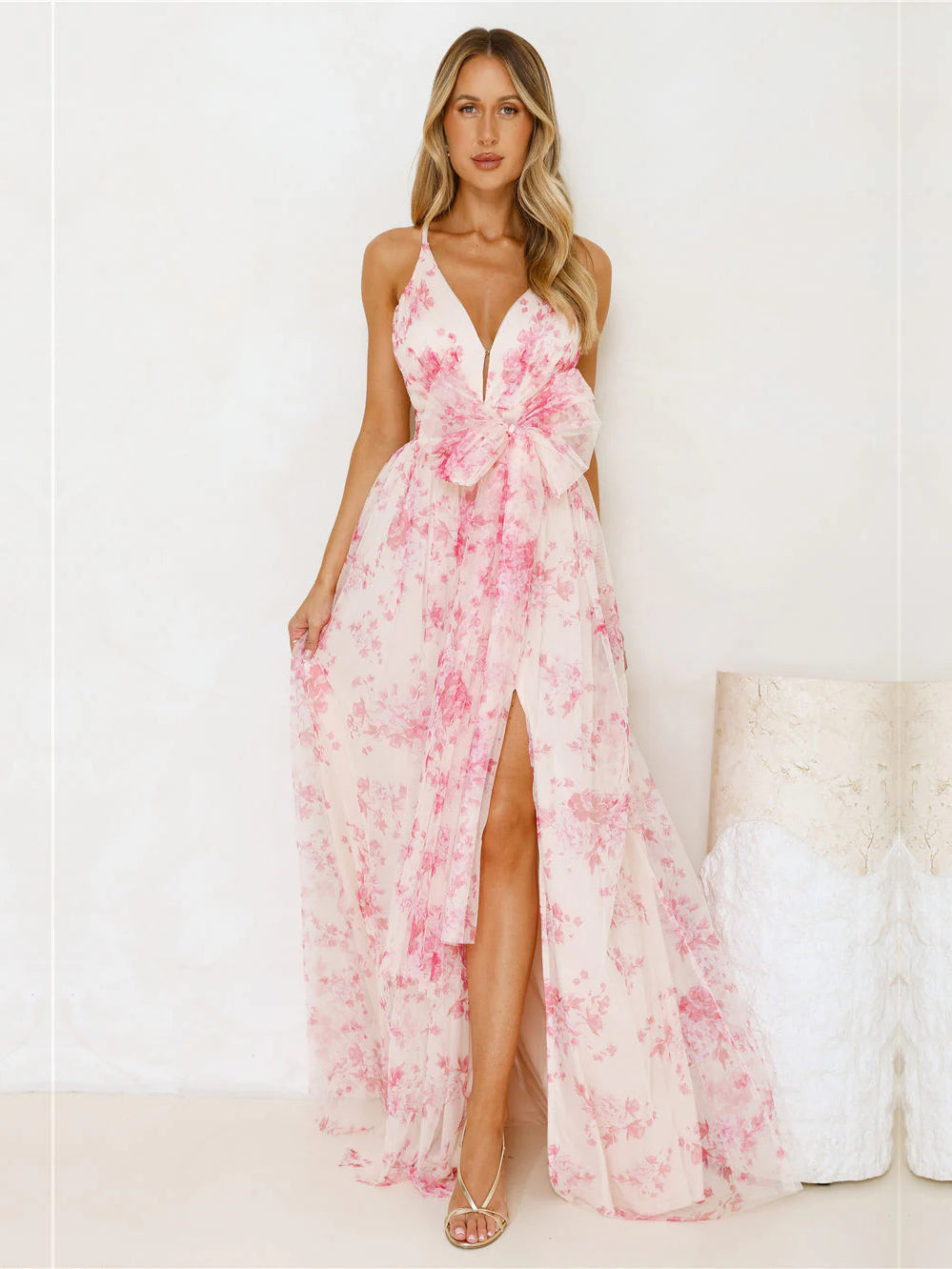 Fuchsia a-line maxi formal dress with halter neckline, full-length front view