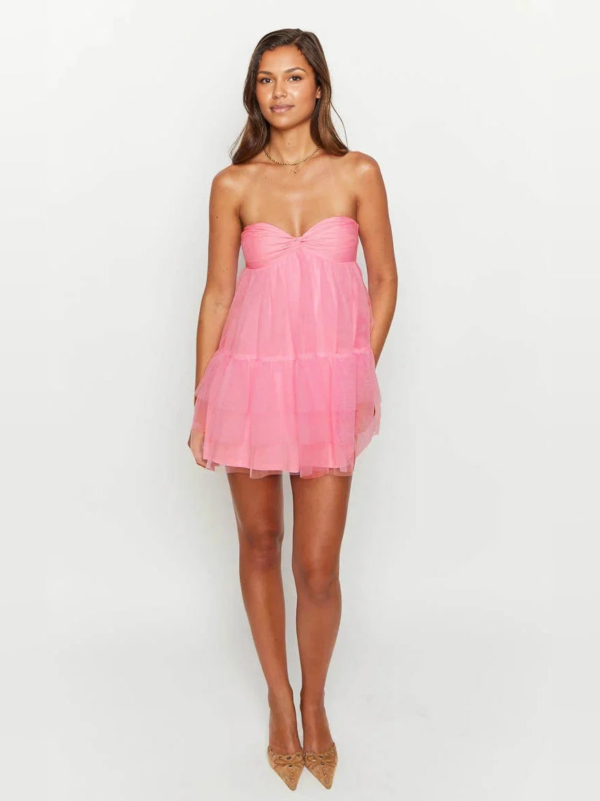 Hot pink tulle mini dress with sweetheart neckline, tiered ruffles, and A-line skirt