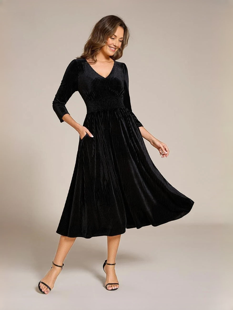 Black velvet V-neck A-line midi dress with long sleeves and gathered waist