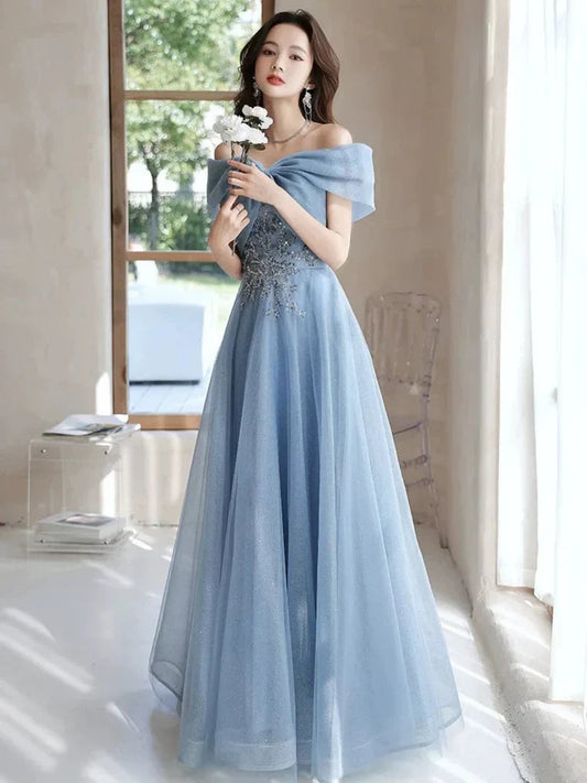 Light blue off-shoulder tulle prom dress with beaded bodice and flowing A-line skirt