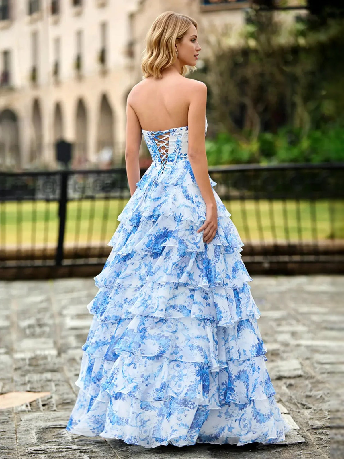 Blue floral sweetheart A-line prom dress with ruffled tiers and thin straps