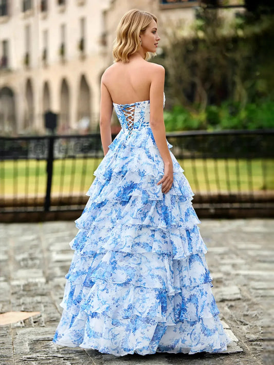Blue floral sweetheart A-line prom dress with ruffled tiers and thin straps