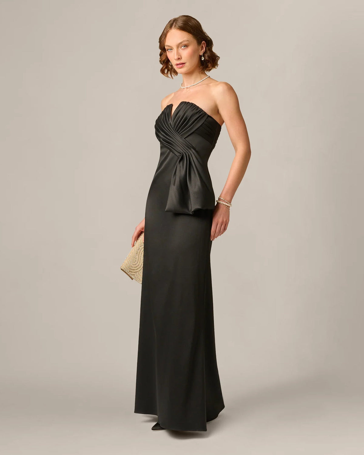 Black strapless maxi dress with pleated sweetheart bodice and draped waist