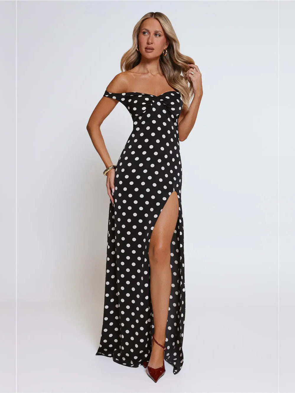 Black a-line maxi formal dress with off-the-shoulder neckline, full-length front view