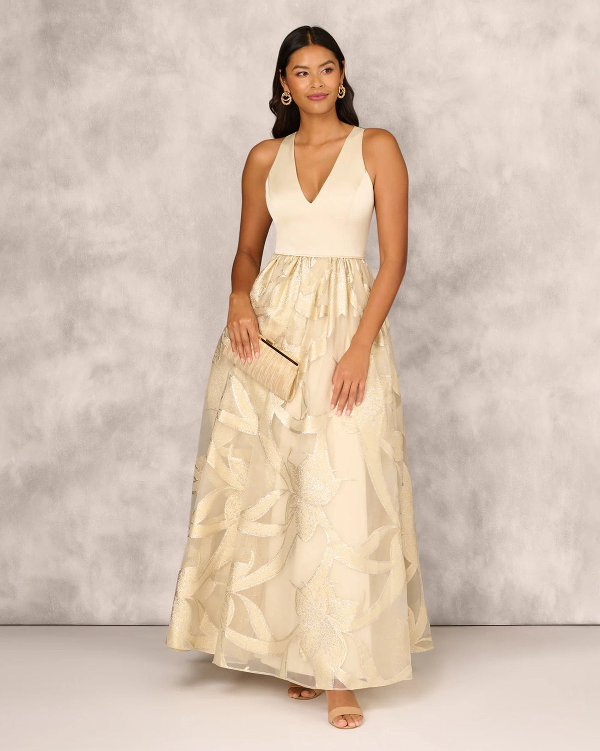 Gold V-neck sleeveless floor-length mother of the bride gown with beaded bodice and full skirt