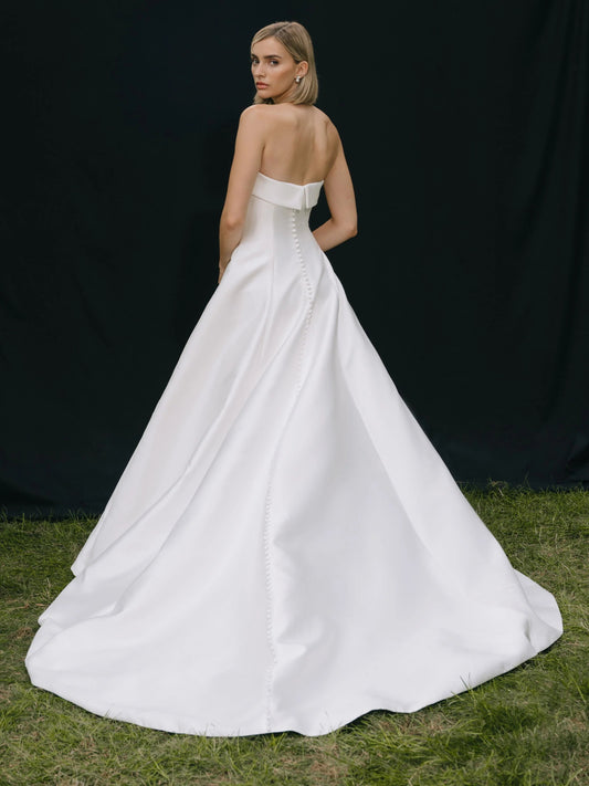 Ivory strapless A-line wedding dress with pearl trim, floor-length satin skirt