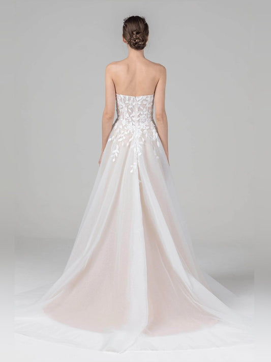 Ivory strapless A-line wedding dress with lace bodice and flowing tulle skirt, back view