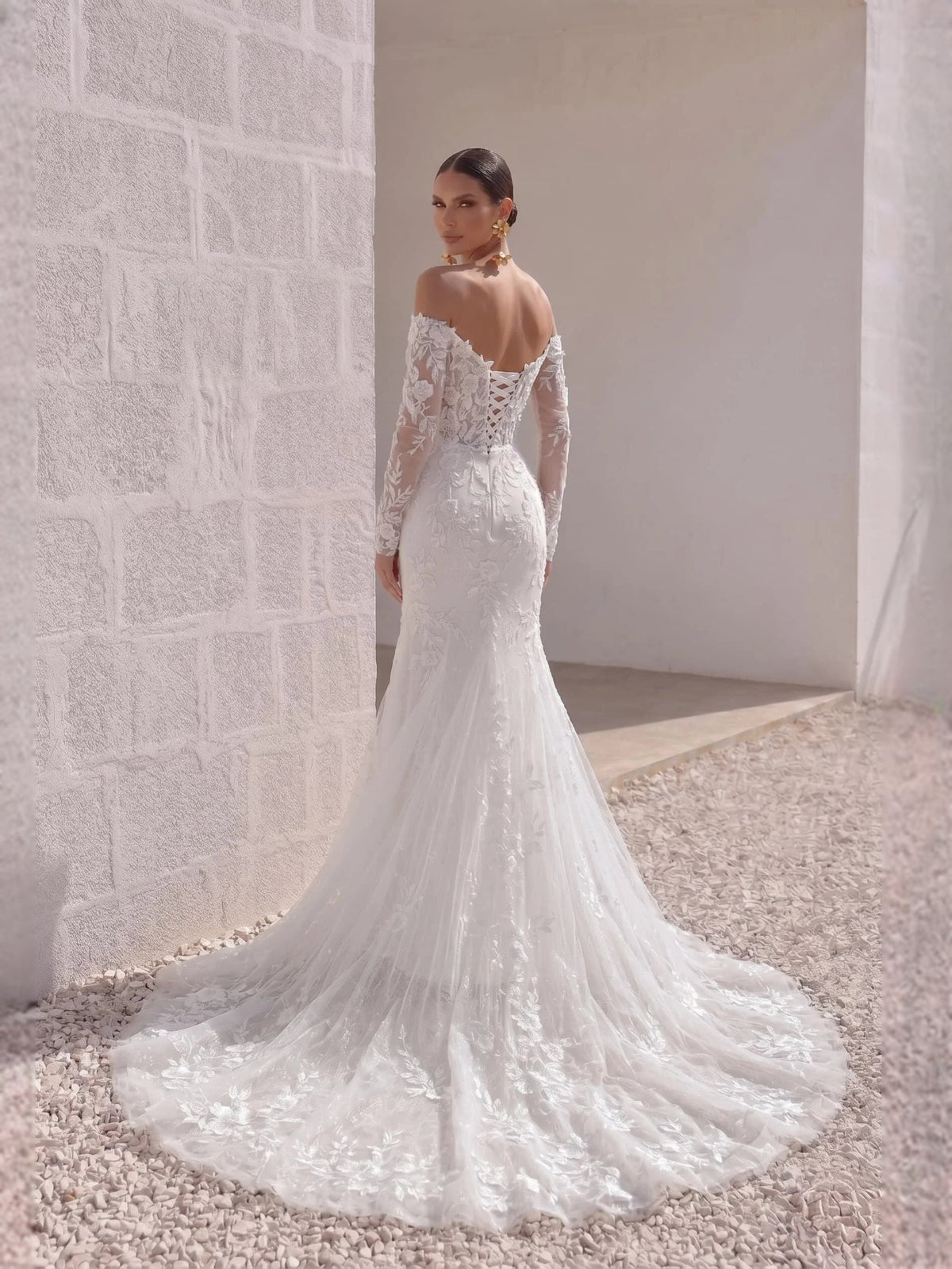 Ivory sweetheart mermaid wedding dress with lace off-shoulder bodice and long sleeves