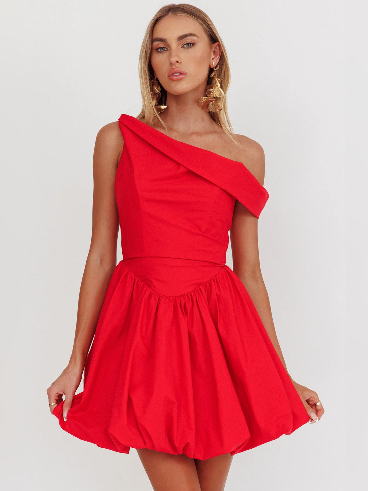 Red asymmetrical mini homecoming dress with one-shoulder draped neckline and gathered skirt