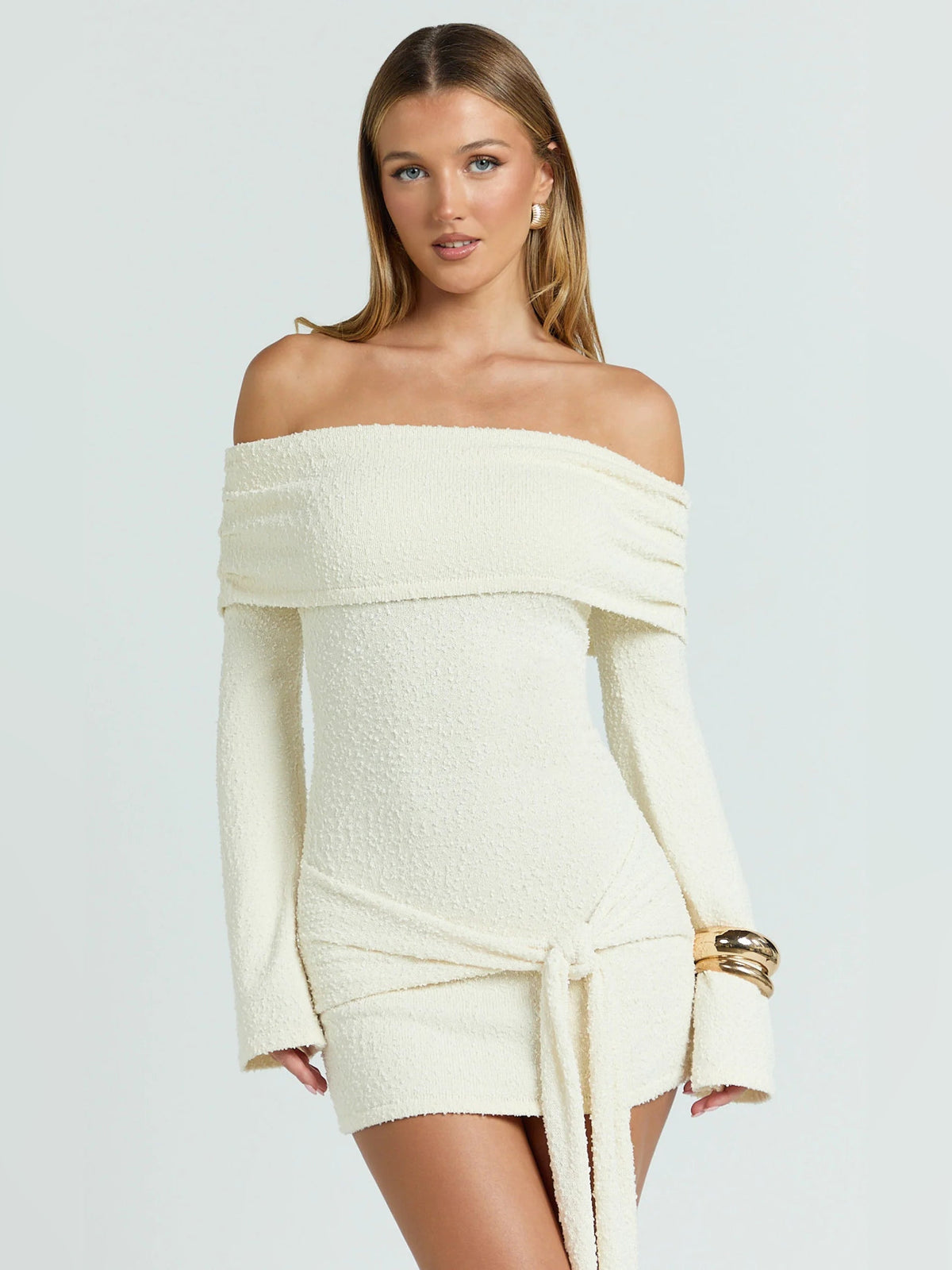 Cream textured off-shoulder mini dress with wide neckline and long sleeves