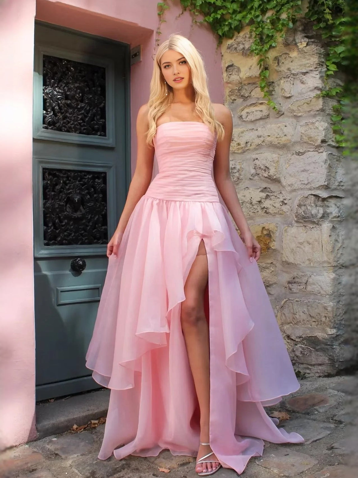 Blush pink strapless ruched prom dress with layered A-line skirt and front slit