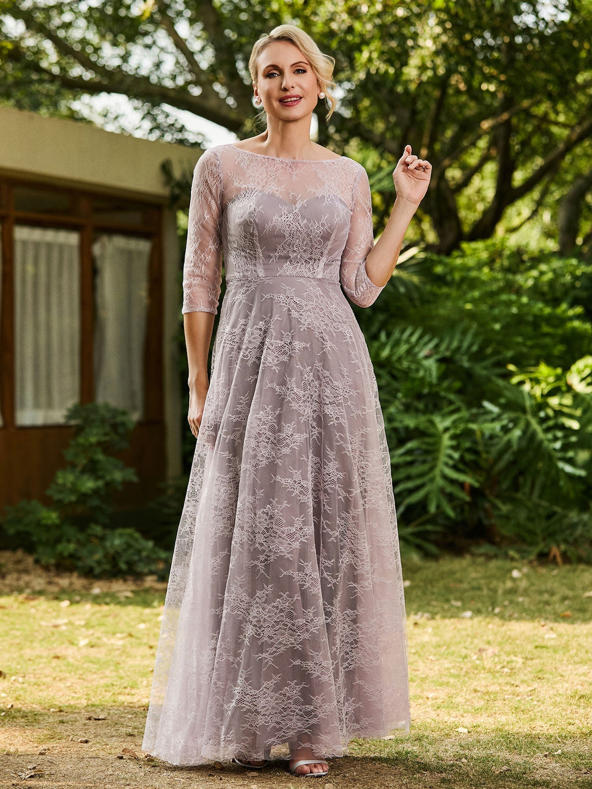 Lilac lace A-line maxi dress with round neckline and 3/4 sleeves